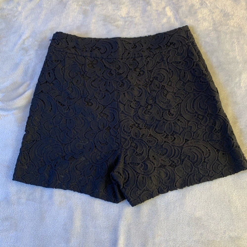 A black 2 piece, shorts and top